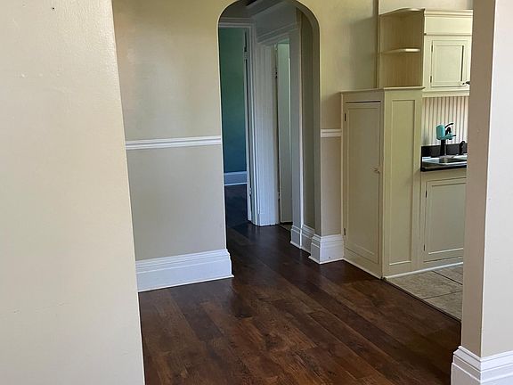 Hallway leading to kitchen, bathroom and bedroom