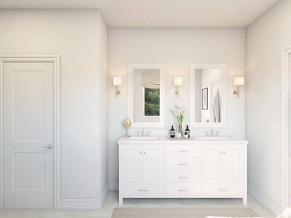 Primary bath featuring freestanding vanity with dual sinks