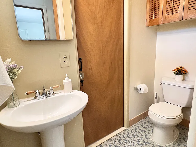 half bathroom is connected to one bedroom