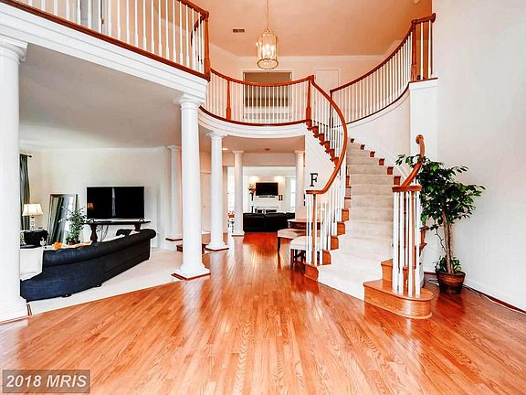 Gorgeous 2-Story Open Foyer with Curved Staircase
