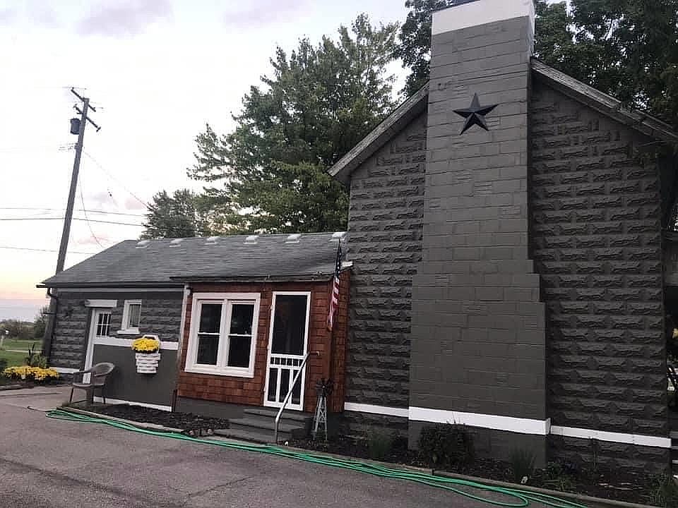 Side of house by driveway 