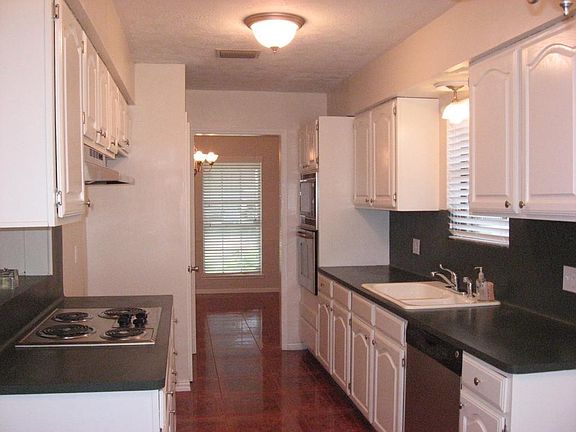 Efficient galley kitchen with tile floor