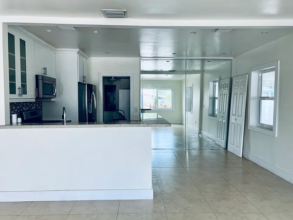 view counter top and kitchen, dinning room area mirror wall