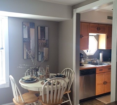 Dining nook leading into kitchen