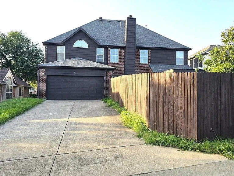 Back of the house with 2 car garages