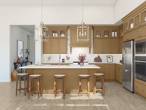 Kitchen with glass upper cabinets and pendant lighting