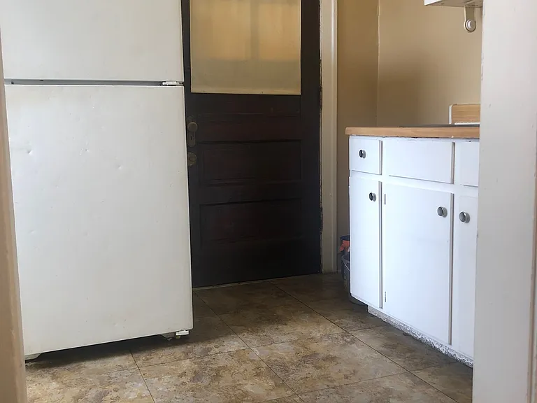 Kitchen with backdoor exit.