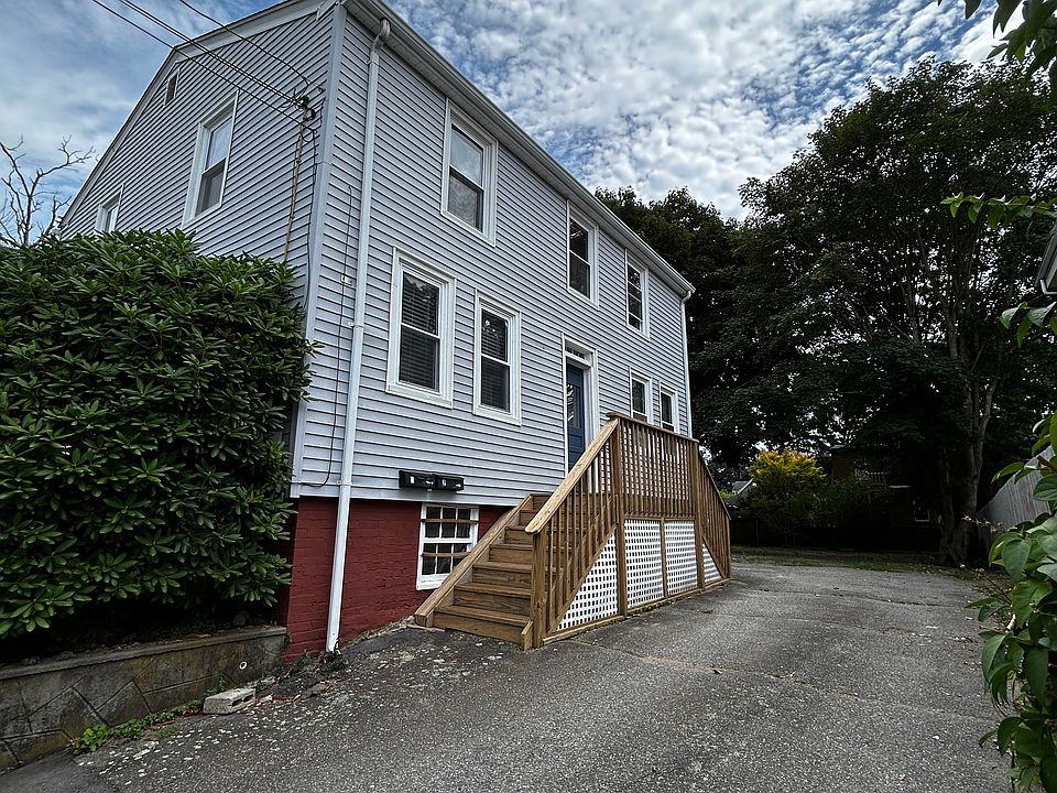 Side view of house and driveway to access off-street parking.