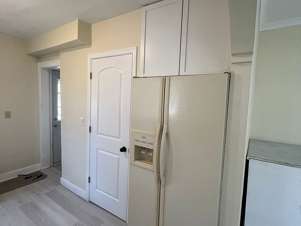 Large side by side refrigerator with new upper cabinets