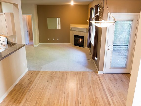 Refrigerator with ice maker, newer microwave oven, hardwood floors