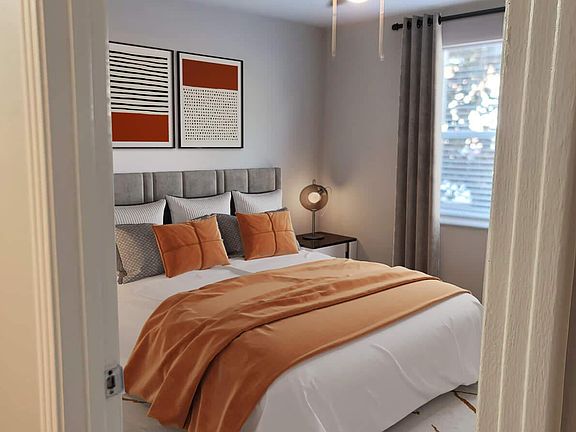 ELEGANT BEDROOM WITH CEILING FANS