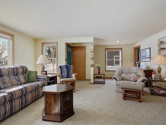 Hardwood Floors Under Carpet in Living Room.