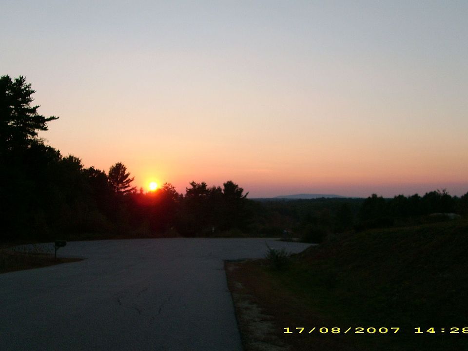 Sunset looking from end of driveway toward mountains