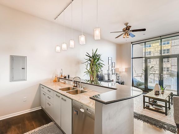 View from kitchen to living. Doors open onto private balcony with views to the northwest.