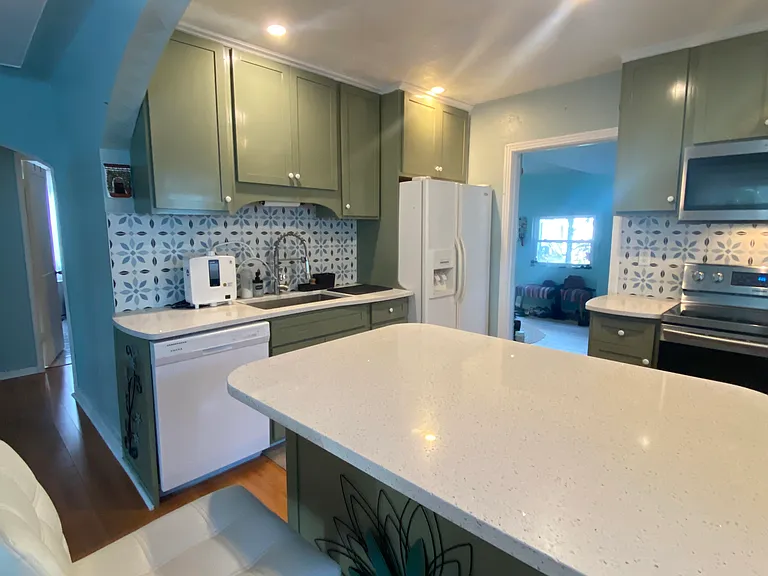rolling quartz island with plenty of storage inside
