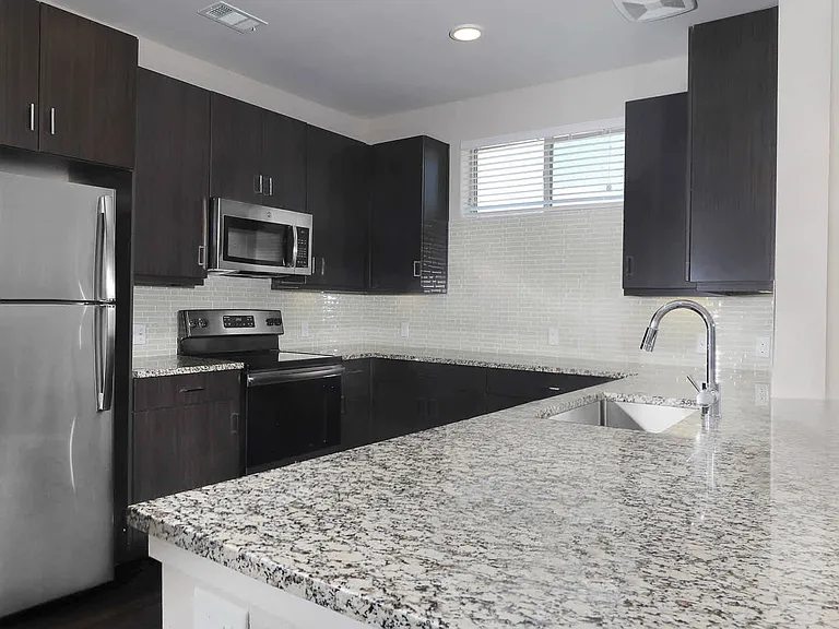 Dining Room and Kitchen with Granite Countertops and Stainless Steel Energy Star Appliances