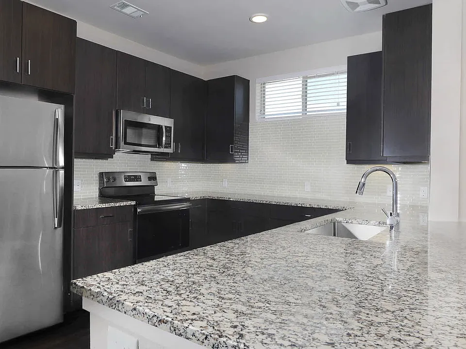 Dining Room and Kitchen with Granite Countertops and Stainless Steel Energy Star Appliances