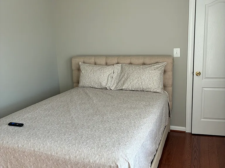 Bedroom #3 with queen size bed and wall mounted TV.