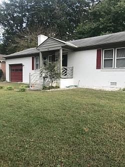 Street view of home showing attached garage