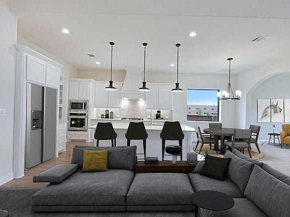 Kitchen is open to great room, virtually staged for demonstration