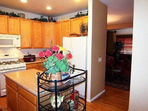 Sunny Kitchen with Golden Oak Cabinetry, Hardwood Floors...
