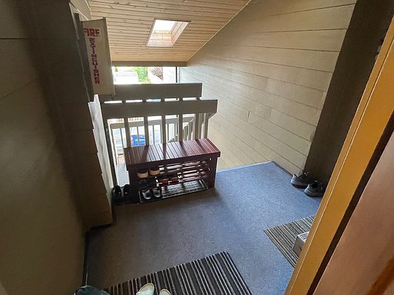 Covered area outside door for shoes