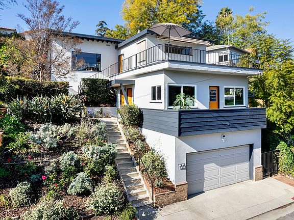 Don't you love the pop of orange on the doors? Studio unit on first floor - 2067 and 2065 on top floor. Double garage