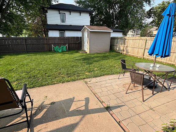 Fenced-in yard with storage shed