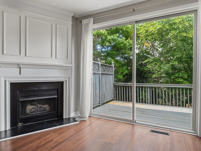 View of fireplace and outdoor deck