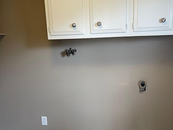 Laundry Room with W/D hook ups and more storage