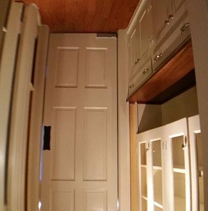A classic "butlers" pantry with hardwood floor