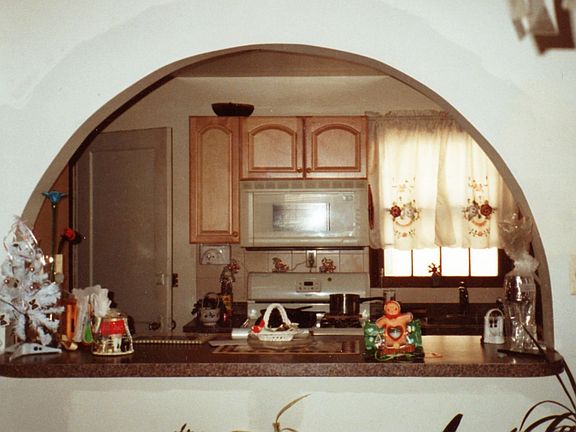 archway from dining into the kitchen