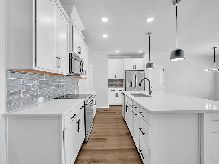 Kitchen. Complete with Quartz counter tops and all stainless steel appliances.