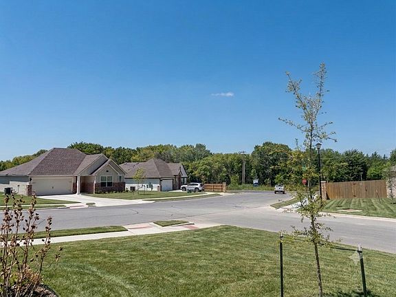 Front porch view. Located near the edge of the neighborhood with fewer homes on the street _ a quiet, serene setting close to open country. And have easy access to main roads _ no winding through the community to get in and out.