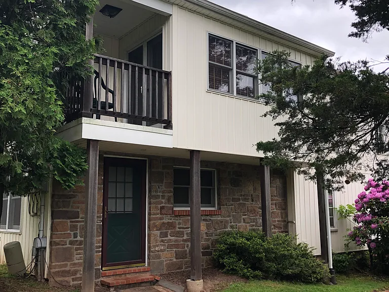 Exterior (available apartment is lower level) -- private entrance.