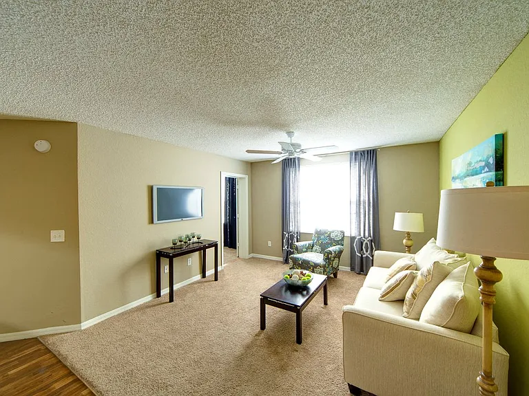Spacious sun-filled living area at Gregory Cove in Jacksonville, FL