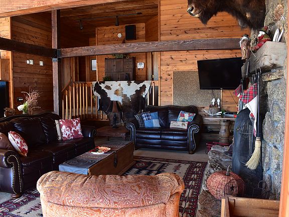 Exquisitely Furnished and Decorated Great Room with Large Stone Wood-Burning Fireplace