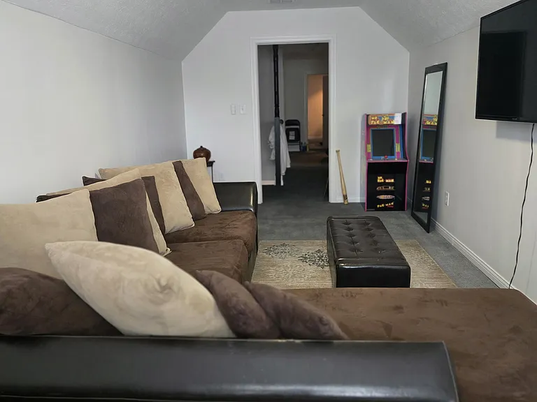 Family Room Over Garage (FROG): Includes a remote-controlled ceiling fan and 50" TV. Other furniture presented in this picture IS NOT INCLUDED.