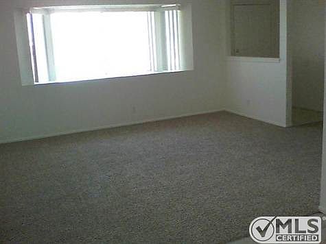 Living room with new carpet.
