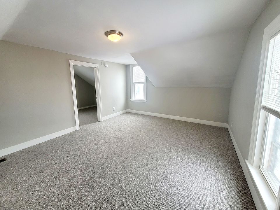Upstairs bedroom with additional storage/sitting space.