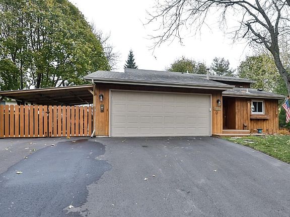This view shows the two car garage plus covered carport, great boat storage.