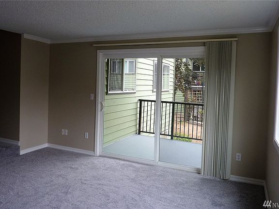 Living room slider that leads out to an expansive covered deck