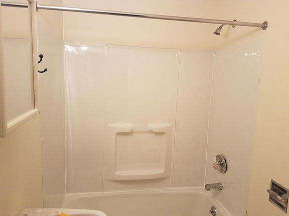 Bathroom with new floor and tub surround