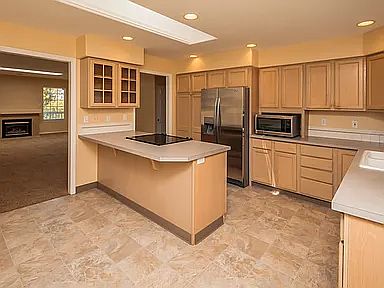 Kitchen has lots of storage, new stove, dishwasher, and garbage disposal