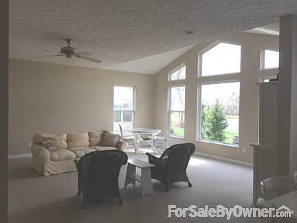 View from Kitchen into family room : Kitchen and family room on the back of the house - pond view
