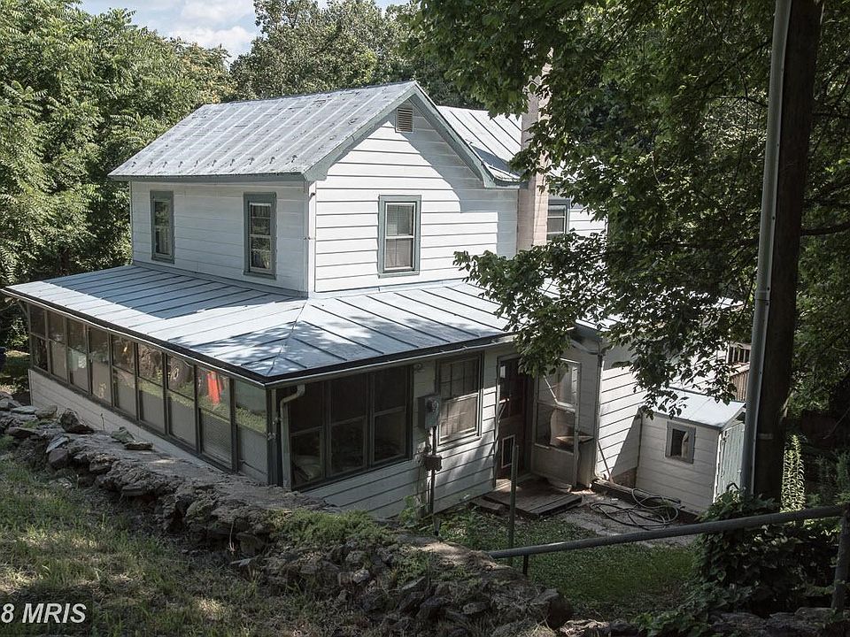Farmhouse nestled into hill