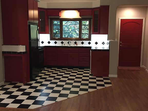 Kitchen and living room are all in one. 
High ceilings.