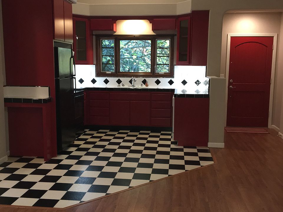 Kitchen and living room are all in one. 
High ceilings.