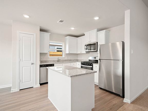 Your new kitchen includes a full suite of stainless steel appliances by Whirlpool.