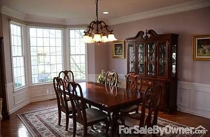 Dinning Room
						:
						Dining room with bay window with Hunter Douglas blinds